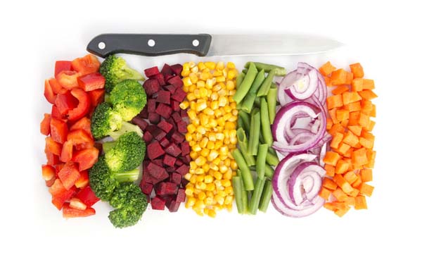 37558895 - cut colorful vegetables in line with knife on white background