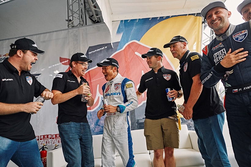 Yoshihide Muroya of Japan celebrates with his team after he won the finals at the third stage of the Red Bull Air Race World Championship in Chiba, Japan on June 4, 2017. // Balazs Gardi/Red Bull Content Pool