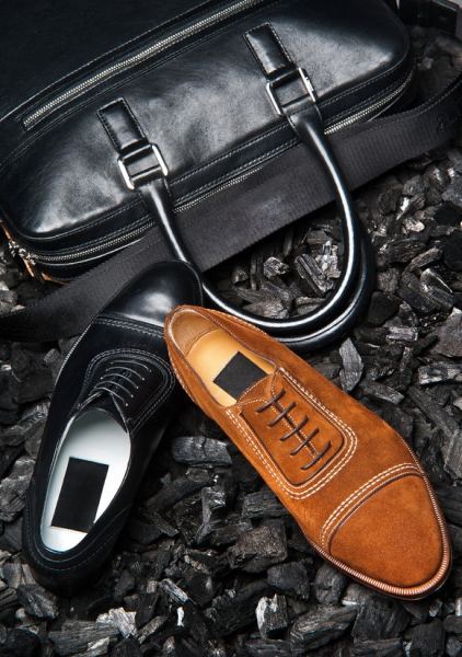 29879802 - close-up view of the shoes of a businessman and his business bag