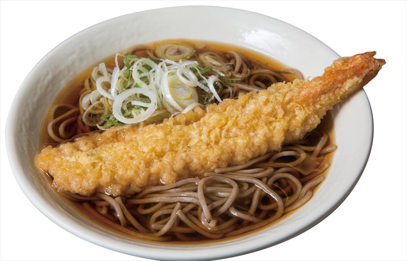 ↑ジャンボ海老天そば(1本)(510円)。甘辛つゆのそばの上に、大ぶりのえび天が1本鎮座する(衣はかなり厚め)。えび天が2本のったそばは670円