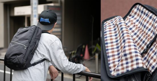 「アクアスキュータム」と「マスターピース」の2WAYバックパックは高い防水性を誇る。クラブチェックの裏地もグッド！