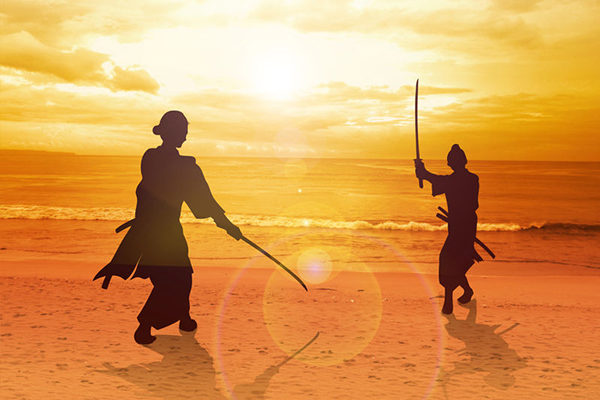 56171065 - two samurai in duel stance facing each other on the beach